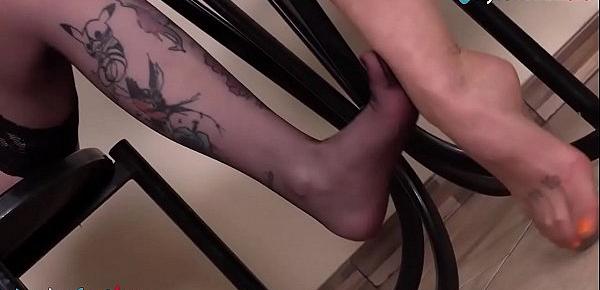  Hot lesbians playing footsies wearing stockings and heels